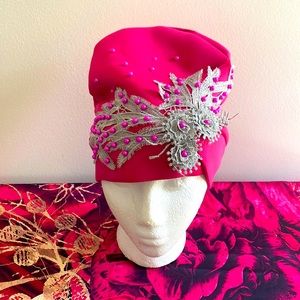 Fuchsia, fitted, tam/hat. Smoke free environment and no pets.